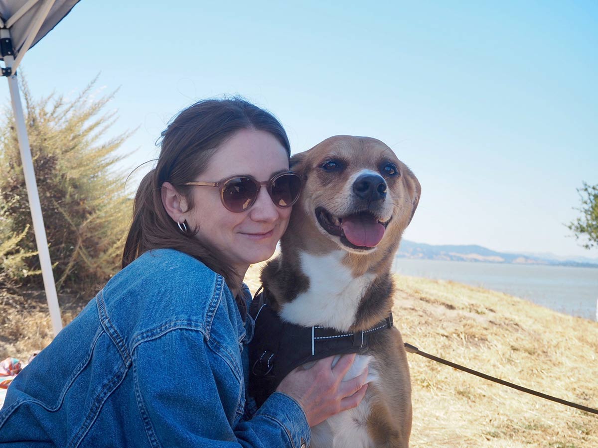 Vanessa Leedy and her dog on a hiking trail